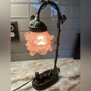 Elegant, vintage bronze lamp with pale pink glass tulip shade.